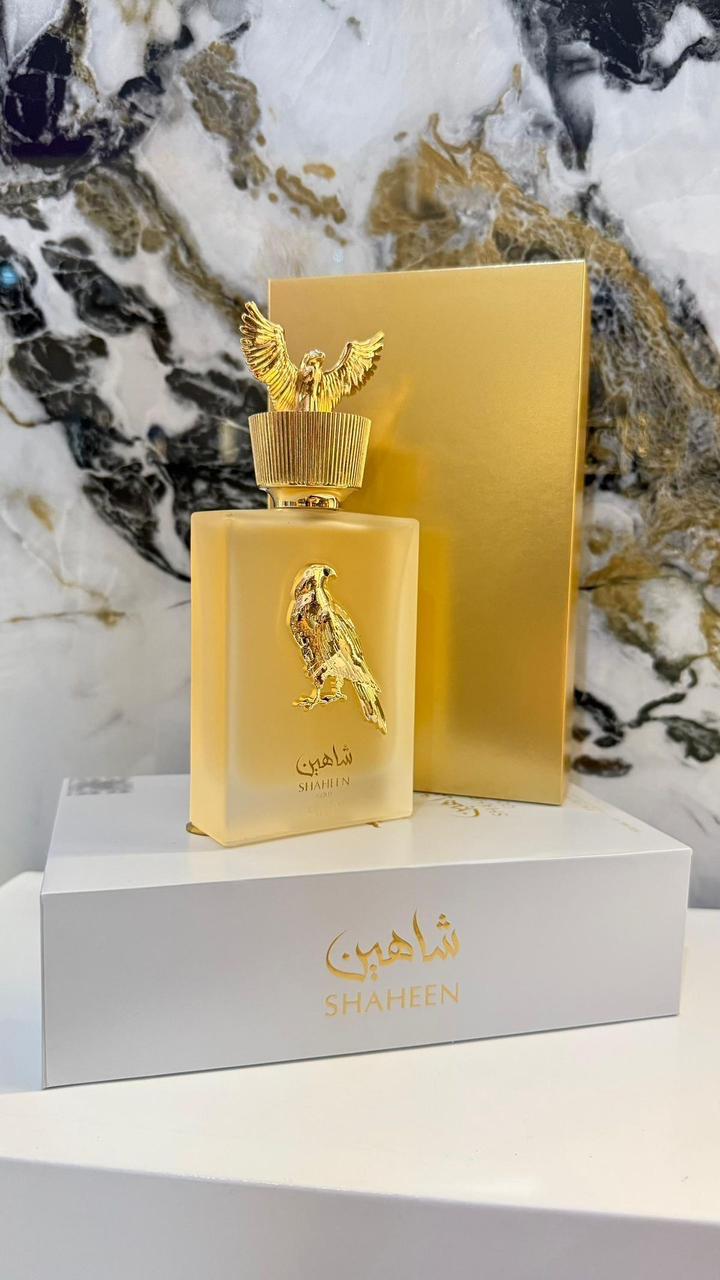 Shaheen EDP 100ml frasco dorado con halcón y caja blanca dorada