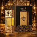 Atheeri Lattafa EDP 100ml frasco dorado con panal de abeja y caja negra dorada