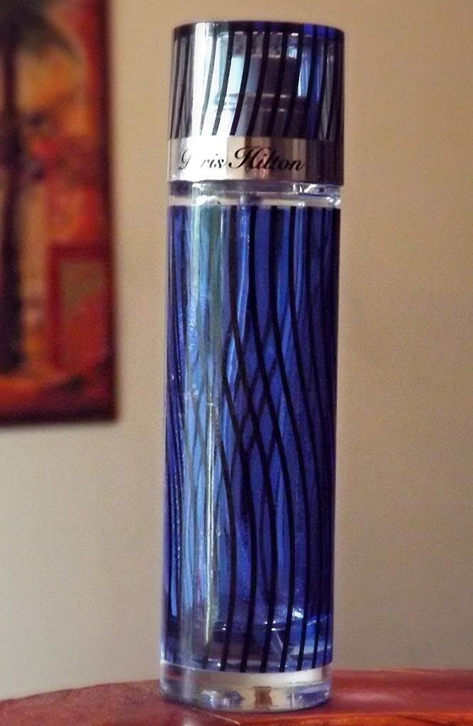 Frasco y caja azul de Paris Hilton for Men de 100 ml